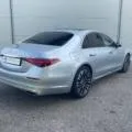 Angled front view of a silver Mercedes-Benz S450 for rent, emphasizing its stylish alloy wheels and sophisticated exterior.